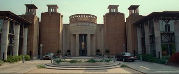 Movie still from “Wonder Woman 1984” (2020), directed by Patty Jenkins – A large building with a circular entrance way; Extreme Wide shot, Low angle