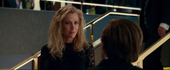 Movie still from “Wonder Woman 1984” (2020), directed by Patty Jenkins – A woman in a black dress talking to another woman; Close Up shot, Over the shoulder angle