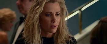 Movie still from “Wonder Woman 1984” (2020), directed by Patty Jenkins – A person with blonde hair; Close Up shot, Over the shoulder angle