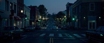 Movie still from “Wonder Woman 1984” (2020), directed by Patty Jenkins – A city street at night lit by street lights; Extreme Wide shot, High angle