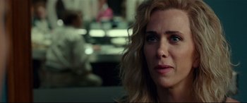 Movie still from “Wonder Woman 1984” (2020), directed by Patty Jenkins – A person with long blonde hair; Close Up shot, Over the shoulder angle