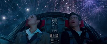 Movie still from “Wonder Woman 1984” (2020), directed by Patty Jenkins – A man and a woman looking up into the night sky; Medium shot, Low angle