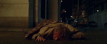 Movie still from “Wonder Woman 1984” (2020), directed by Patty Jenkins – A man laying on the ground in the dark; Wide shot, High angle