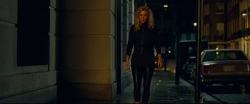 Movie still from “Wonder Woman 1984” (2020), directed by Patty Jenkins – A woman walking down the street at night; Medium shot, Low angle