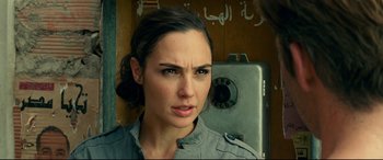 Movie still from “Wonder Woman 1984” (2020), directed by Patty Jenkins – A person standing next to a wall; Close Up shot, Over the shoulder angle