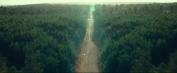 Movie still from “Wonder Woman 1984” (2020), directed by Patty Jenkins – An aerial view of a boat on a river; Extreme Wide shot, High angle