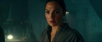 Movie still from “Wonder Woman 1984” (2020), directed by Patty Jenkins – A person wearing a gray shirt; Close Up shot, Over the shoulder angle