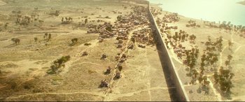 Movie still from “Wonder Woman 1984” (2020), directed by Patty Jenkins – An aerial view of an area that has a lot of buildings on it; Extreme Wide shot, Overhead angle