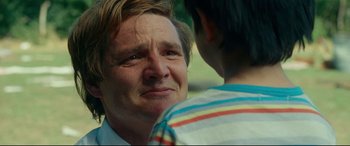 Movie still from “Wonder Woman 1984” (2020), directed by Patty Jenkins – An older man and a young boy looking at each other; Close Up shot, Over the shoulder angle