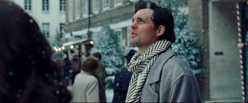 Movie still from “Wonder Woman 1984” (2020), directed by Patty Jenkins – A man wearing a scarf standing in the snow; Close Up shot, Low angle