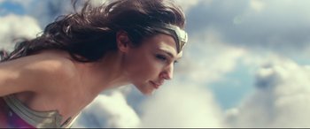 Movie still from “Wonder Woman 1984” (2020), directed by Patty Jenkins – A person wearing a headband; Close Up shot, Low angle