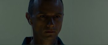 A person's face in the dark