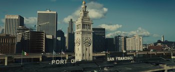 Movie still from “Zodiac” (2007), directed by David Fincher – A tall clock tower in the middle of a city; Extreme Wide shot, Low angle