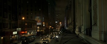Movie still from “Zodiac” (2007), directed by David Fincher – A city street at night filled with lots of traffic; Extreme Wide shot, High angle