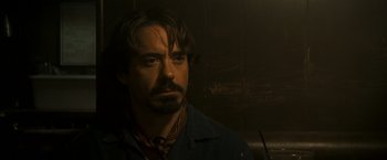 Movie still from “Zodiac” (2007), directed by David Fincher – A person with a beard; Close Up shot, Over the shoulder angle