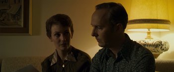 Movie still from “Zodiac” (2007), directed by David Fincher – A man and a woman looking at one another; Close Up shot, Over the shoulder angle