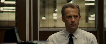 Movie still from “Zodiac” (2007), directed by David Fincher – A man in a white dress shirt and a tie; Close Up shot, Over the shoulder angle