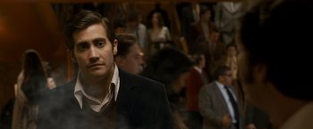 Movie still from “Zodiac” (2007), directed by David Fincher – A person wearing a suit and tie; Close Up shot, Over the shoulder angle