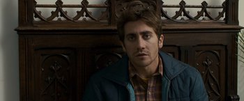 Movie still from “Zodiac” (2007), directed by David Fincher – A person sitting in a chair; Close Up shot, Over the shoulder angle