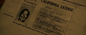 Movie still from “Zodiac” (2007), directed by David Fincher – An old california driver's license is shown on top; Extreme Close Up shot, Overhead angle