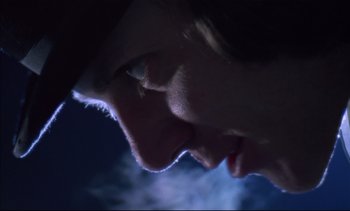 Movie still from “A Clockwork Orange” (1971), directed by Stanley Kubrick – A man's face in the dark; Extreme Close Up shot, Low angle