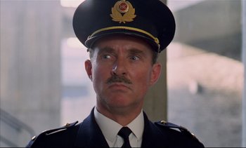 Movie still from “A Clockwork Orange” (1971), directed by Stanley Kubrick – A person wearing a uniform; Close Up shot, Low angle