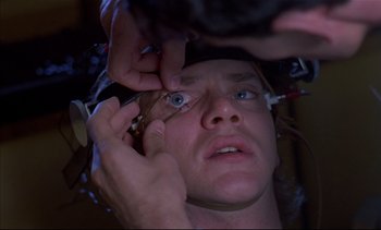 Movie still from “A Clockwork Orange” (1971), directed by Stanley Kubrick – A man is being examined by an ophthalmologist; Close Up shot, High angle