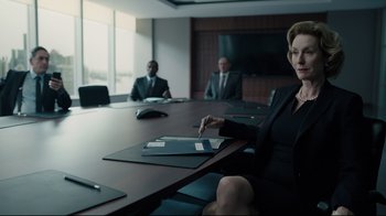 Movie still from “A Cure for Wellness” (2016), directed by Gore Verbinski – A group of people sitting at a table in a room; Medium shot, Over the shoulder angle