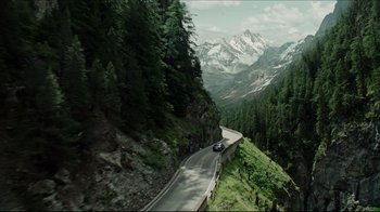 Movie still from “A Cure for Wellness” (2016), directed by Gore Verbinski – A car driving down a winding road in the mountains; Extreme Wide shot, High angle