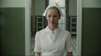 Movie still from “A Cure for Wellness” (2016), directed by Gore Verbinski – A woman wearing a white nurse's uniform and hat; Close Up shot, Low angle