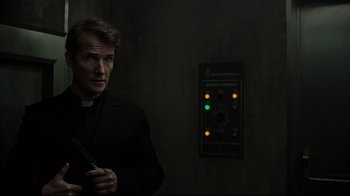 Movie still from “A Cure for Wellness” (2016), directed by Gore Verbinski – A man standing in front of an elevator; Medium shot, Low angle