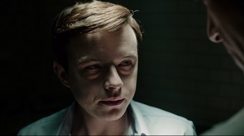 Movie still from “A Cure for Wellness” (2016), directed by Gore Verbinski – A person wearing a white shirt; Close Up shot, Low angle