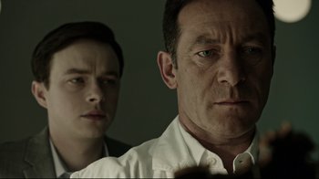 Movie still from “A Cure for Wellness” (2016), directed by Gore Verbinski – A man and a boy looking at the camera; Close Up shot, Over the shoulder angle