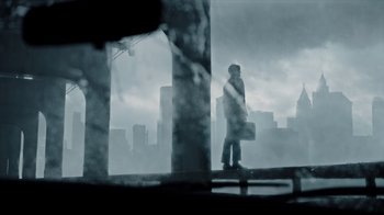 Movie still from “A Cure for Wellness” (2016), directed by Gore Verbinski – A man walking on a bridge in the fog; Wide shot, Low angle