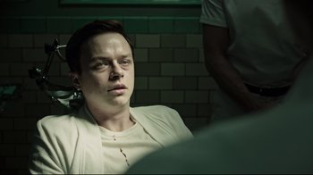 Movie still from “A Cure for Wellness” (2016), directed by Gore Verbinski – A man in a white shirt with blood on his face; Close Up shot, High angle