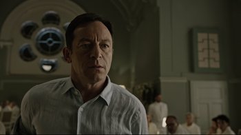 Movie still from “A Cure for Wellness” (2016), directed by Gore Verbinski – A man standing in front of a group of people; Close Up shot, Low angle