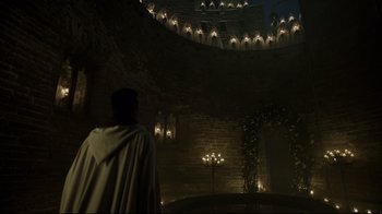 Movie still from “A Cure for Wellness” (2016), directed by Gore Verbinski – A man standing in front of a wall with lights on it; Extreme Wide shot, Low angle