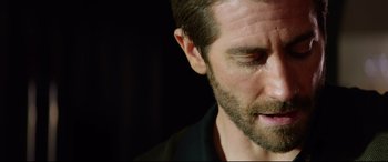 Movie still from “Ambulance” (2022), directed by Michael Bay – A man's face with a beard; Close Up shot, Low angle