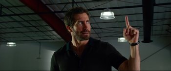 Movie still from “Ambulance” (2022), directed by Michael Bay – A person wearing a black shirt; Close Up shot, Low angle