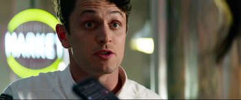 Movie still from “Ambulance” (2022), directed by Michael Bay – A person talking on a cell phone; Close Up shot, Low angle