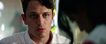 Movie still from “Ambulance” (2022), directed by Michael Bay – A man's face as he looks at the camera; Close Up shot, Over the shoulder angle