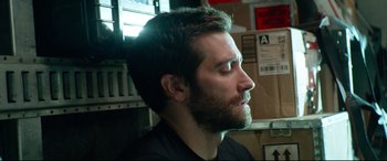 Movie still from “Ambulance” (2022), directed by Michael Bay – A person with a beard looking to the side; Close Up shot, Low angle