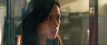 Movie still from “Ambulance” (2022), directed by Michael Bay – A beautiful young woman with long dark brown hair; Close Up shot, Low angle