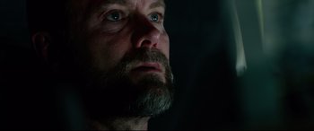 Movie still from “Ambulance” (2022), directed by Michael Bay – A person with a beard; Close Up shot, Low angle