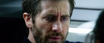 Movie still from “Ambulance” (2022), directed by Michael Bay – A man with a beard and blue eyes; Close Up shot, Over the shoulder angle