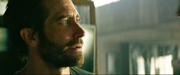 Movie still from “Ambulance” (2022), directed by Michael Bay – A person with a beard; Close Up shot, Over the shoulder angle