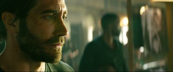 Movie still from “Ambulance” (2022), directed by Michael Bay – A person with a beard; Close Up shot, Over the shoulder angle