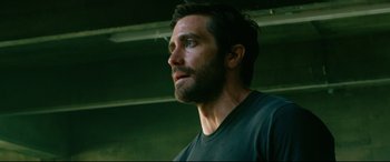 Movie still from “Ambulance” (2022), directed by Michael Bay – A man with a beard is looking upward; Close Up shot, Low angle