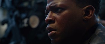 Movie still from “Ambulance” (2022), directed by Michael Bay – A man's face in the dark; Close Up shot, Low angle