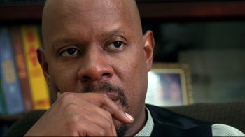 Movie still from “American History X” (1998), directed by Tony Kaye – A person with his hand under his chin; Close Up shot, Low angle